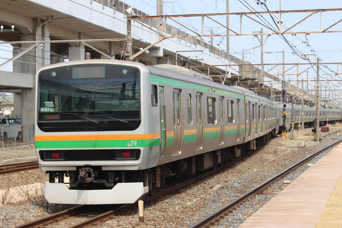 A JR train arriving at a railway station in Tochigi Prefecture, Japan.