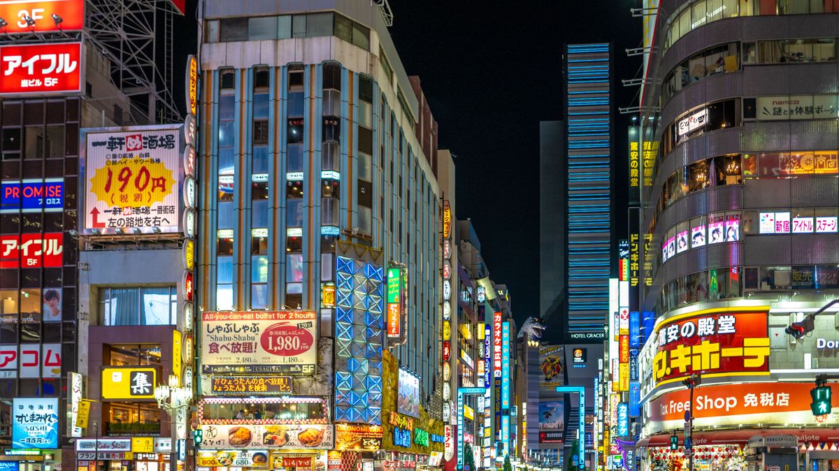 Colorful neon-lit cityscape of downtown Tokyo, Japan, showcasing vibrant urban life and architecture at night.