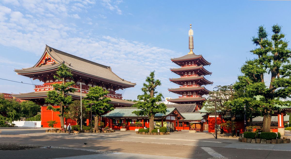 Sunny view of Senso-ji Temple and Five-Storied Pagoda in Tokyo, showcasing traditional Japanese architecture.